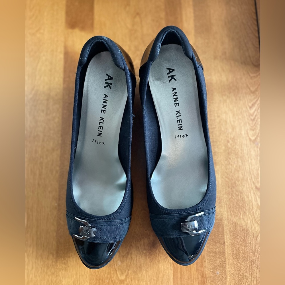 Gently worn Anne Klein iflex wedge heals with patent leather tips and heals.